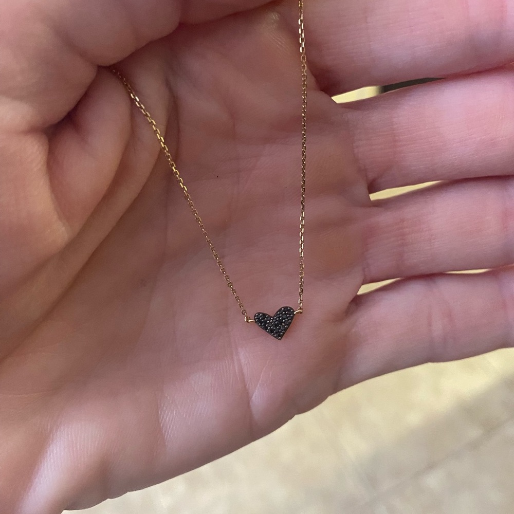Kendra Scott fine jewelry 14k gold and black diamond heart pendant.